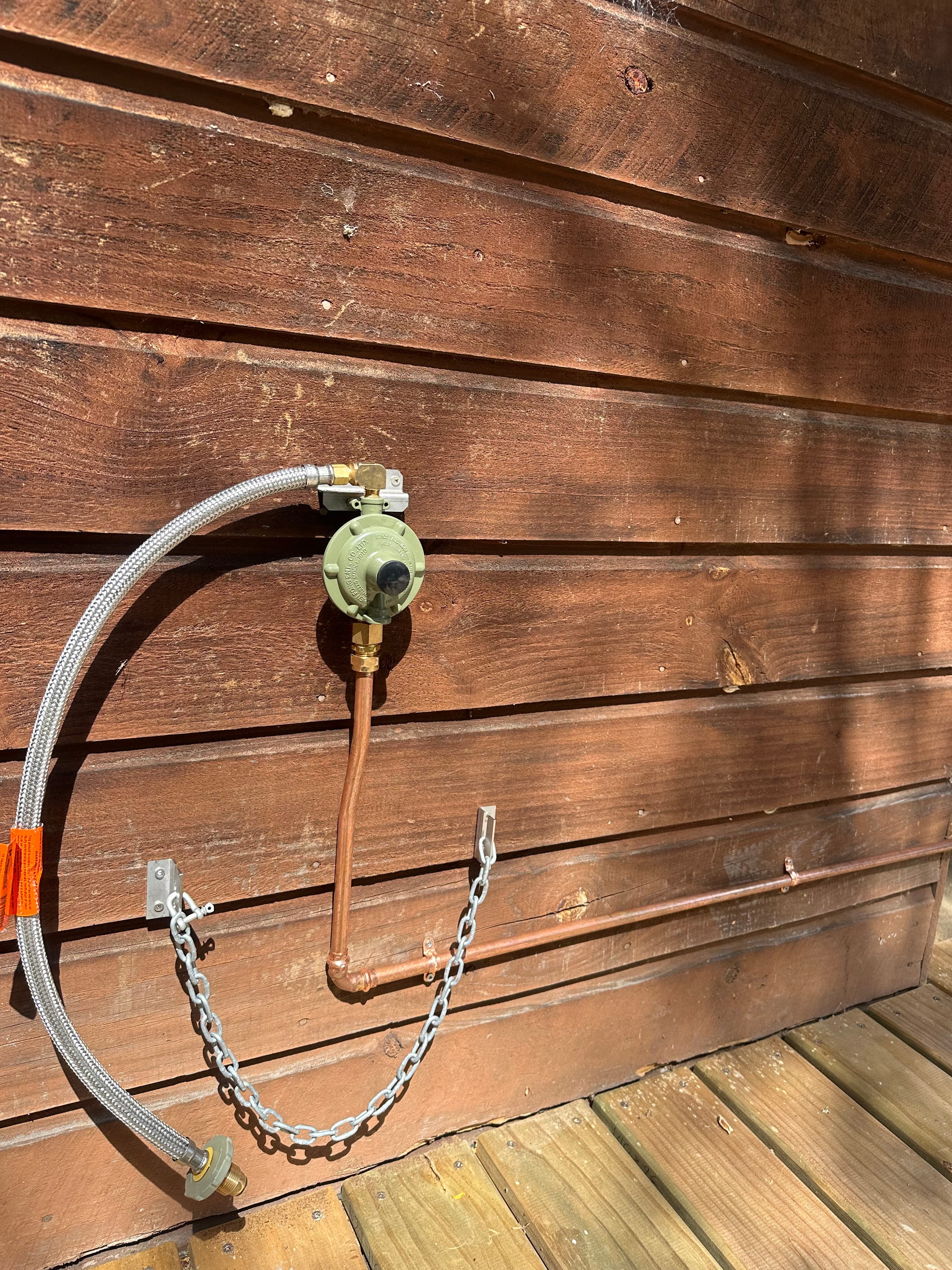 LPG gas regulator on timber deck